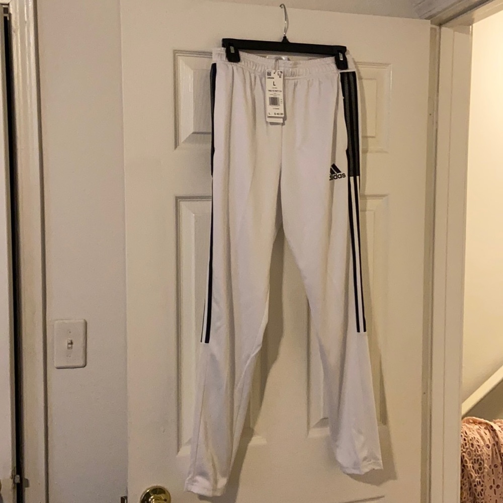Brand new Tiro TK pants for kids. Size large. NWT